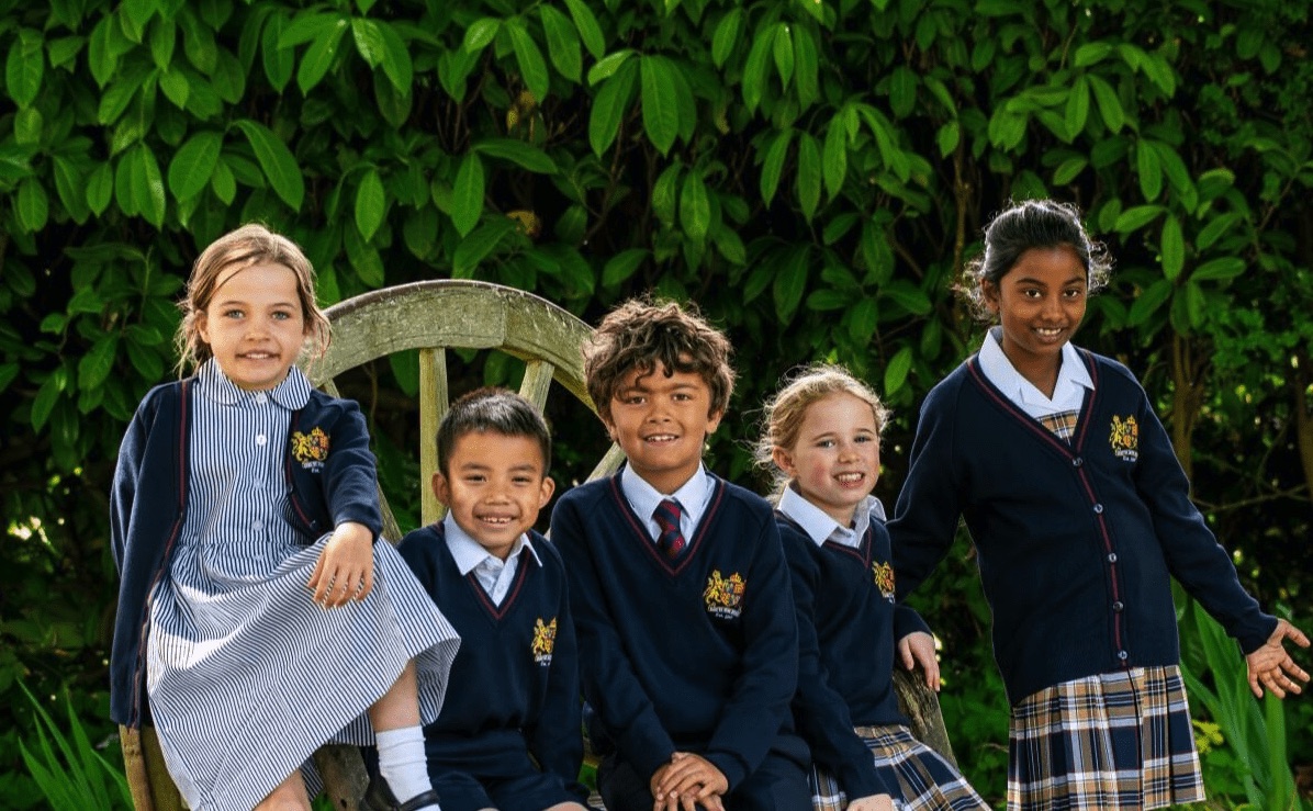 Happy smiling pupils at King Edward VI Prep School in Romsey